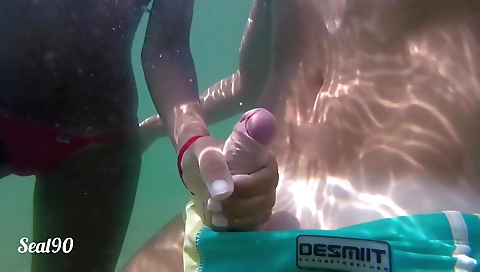 Amateur brunette handjob and creampie in the ocean