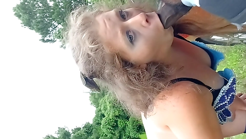 Outdoor milf gets a facial after her black lover's cock