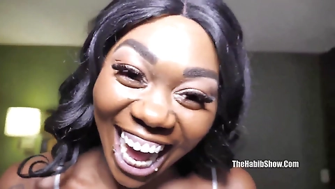 Ebony hottie with a tattooed ass is getting fucked by a black cock