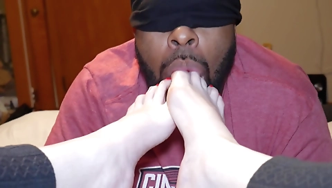 Amateur foot fetish video with a red painted toes inside the mouth