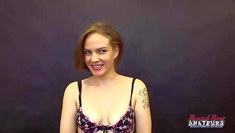 Blonde teen 18+ with tattooed hands and blue eyes sucking a black dick