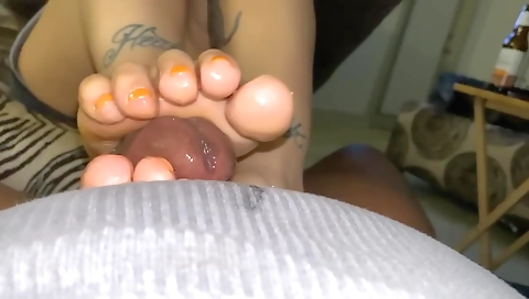 Foot-job from a tattooed dude in homemade interracial porn